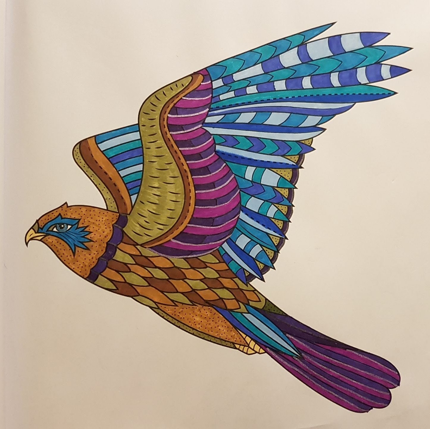 Falcon-like bird, flying towards the left, with brown body and purple & blue wing and tail feathers